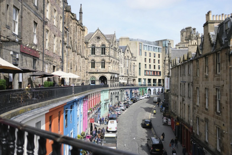 a very narrow city with a bridge over it