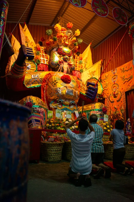 a group of people are hanging decorations in a house