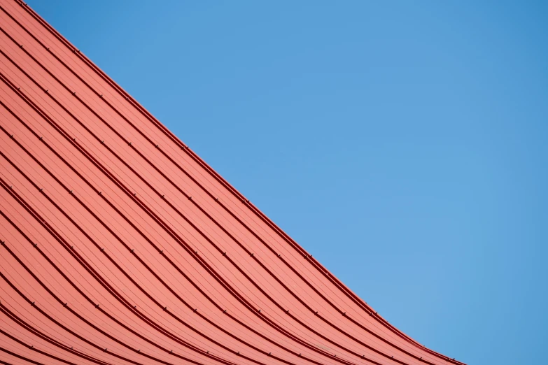 the top side of a building and the plane flying in the air