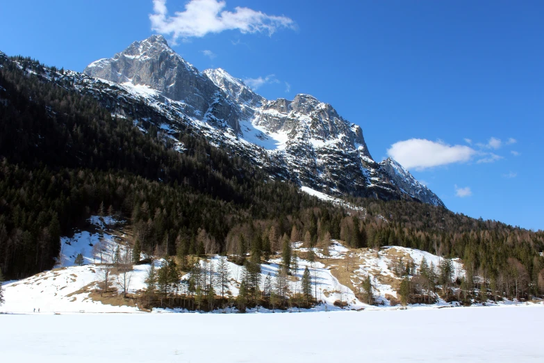 a view from the bottom of a snow covered mountain