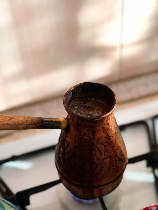 wooden handle on top of a tea pot