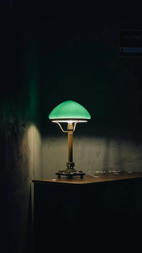 a bright green lamp in a dark room