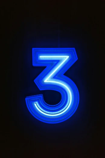 a neon sign that says, 3, with the numbers 3