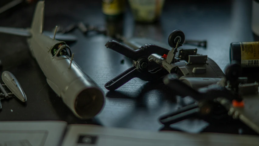 a collection of assorted miniature toy planes sitting on top of a table