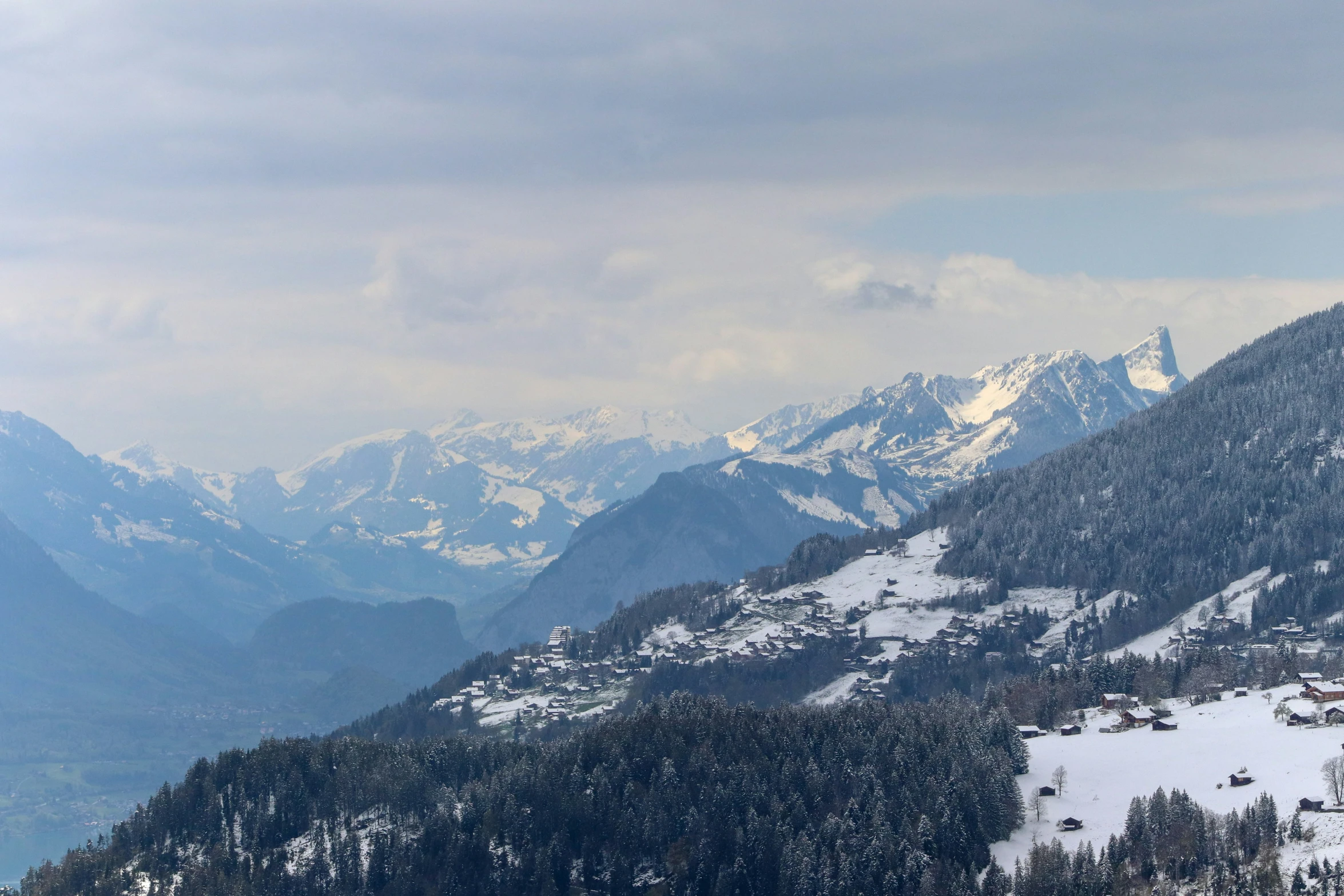 the snowy mountain top is covered in snow