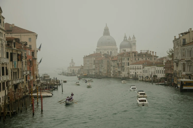 boats and some buildings on a body of water