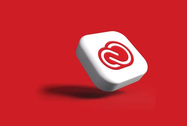 a red and white dice with a q logo on it