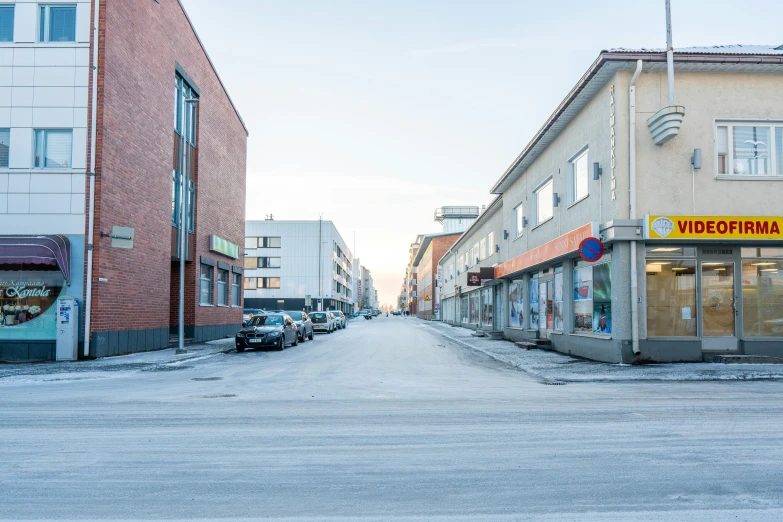 a city street has several stores on the buildings