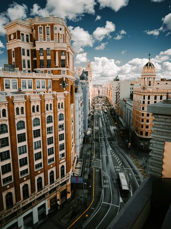 looking down at a street with buildings and cars