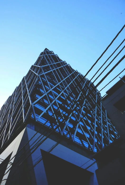 a building is shown in the middle of blue sky