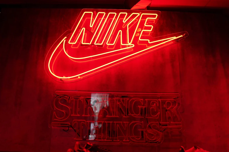 a neon sign is displayed on the wall
