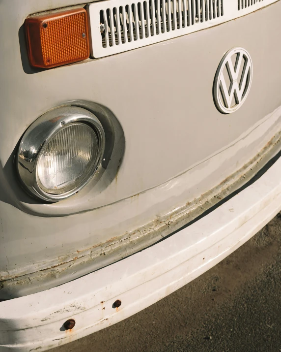 front of a white vw bus with grilles