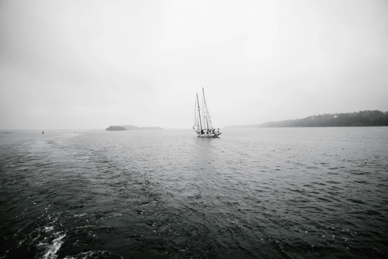 an image of a ship going by in the middle of the ocean