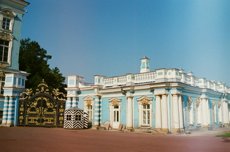 a large building with a massive blue and white building on the corner