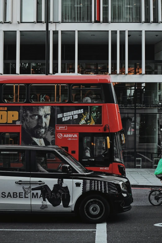 the bus is stopped next to the double decker bus