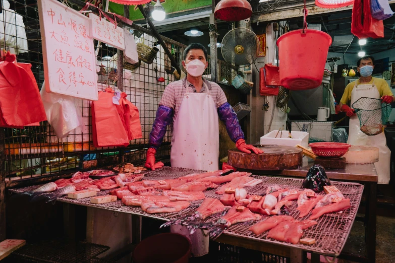 a person standing in front of food on a table