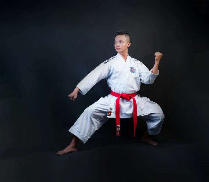 a man poses for the camera in a karate pose