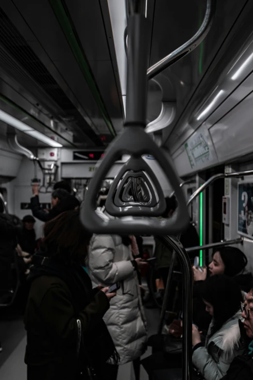 people are riding a commuter bus in the subway