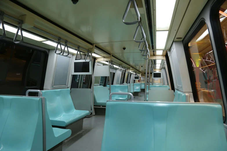 a very pretty blue seats inside a big train