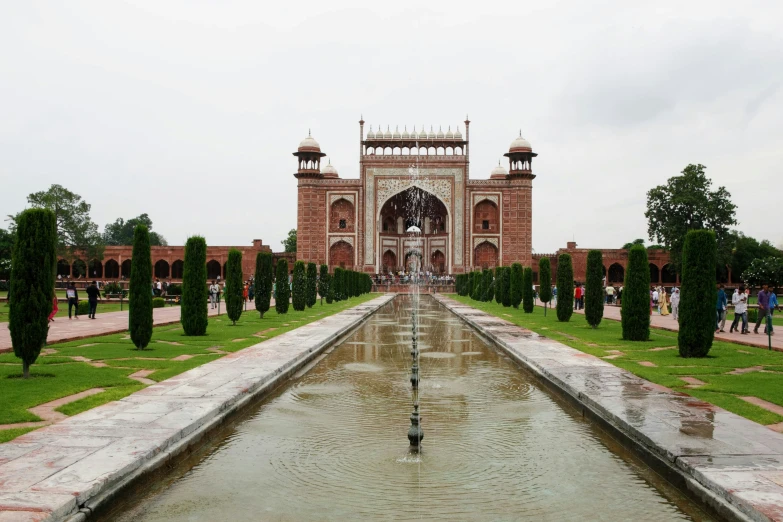 an ornate building has many columns, and it appears to be a reflection of the palace's arch