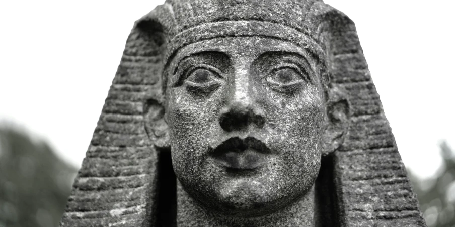 black and white image of statue of a egyptian