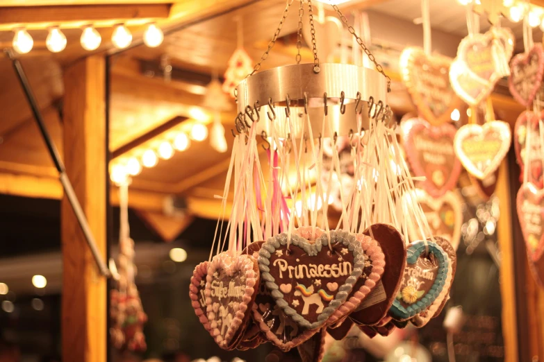 a close up of some hanging candy hearts