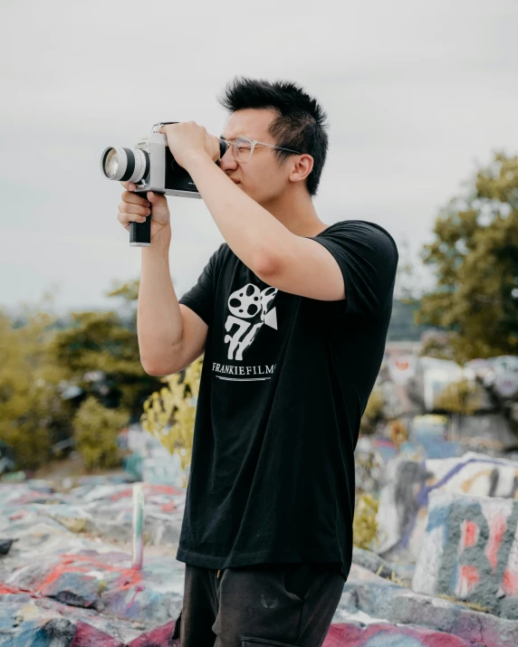 a man takes a po of himself with a camera