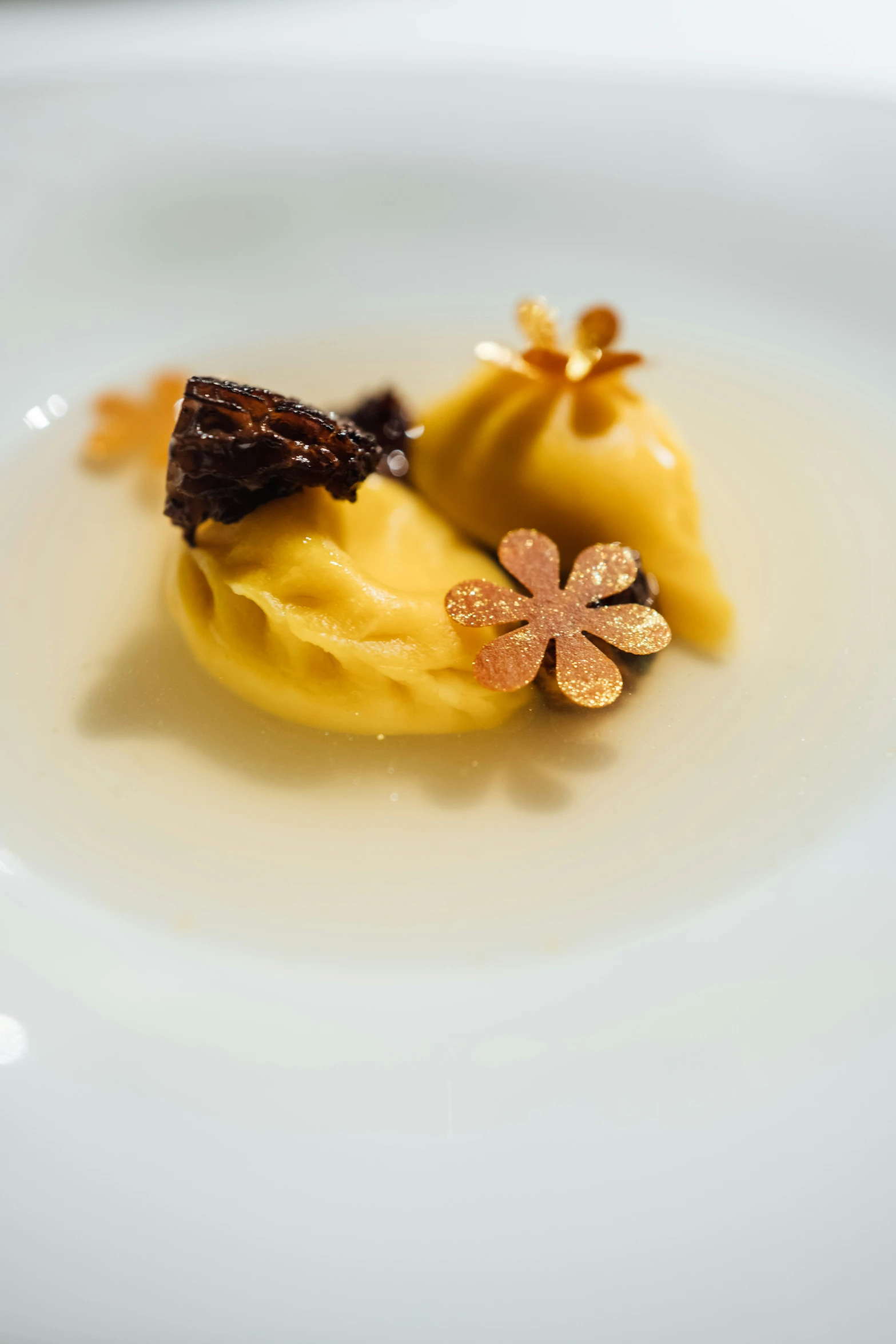 the meal on the plate has flower decorations