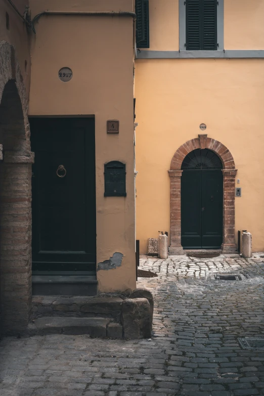 the door is open in front of a brown wall