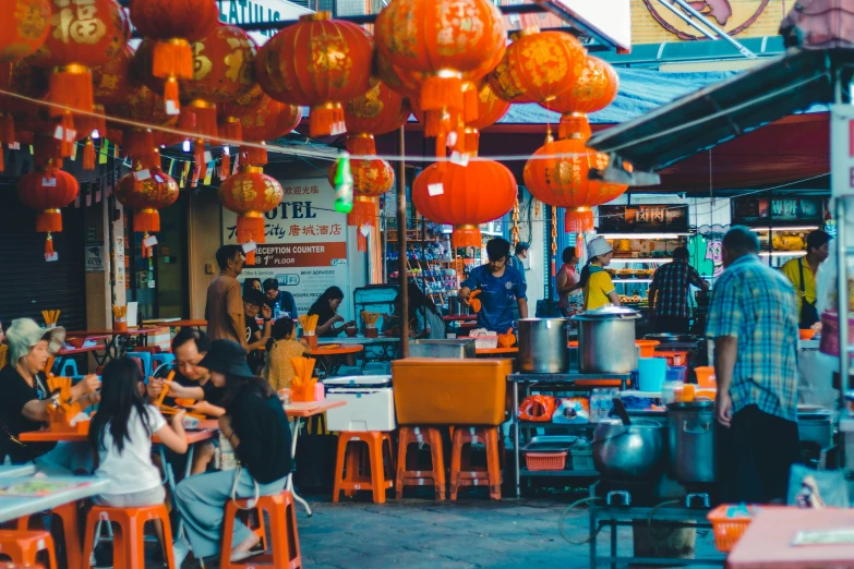 a street scene with some people sitting and eating