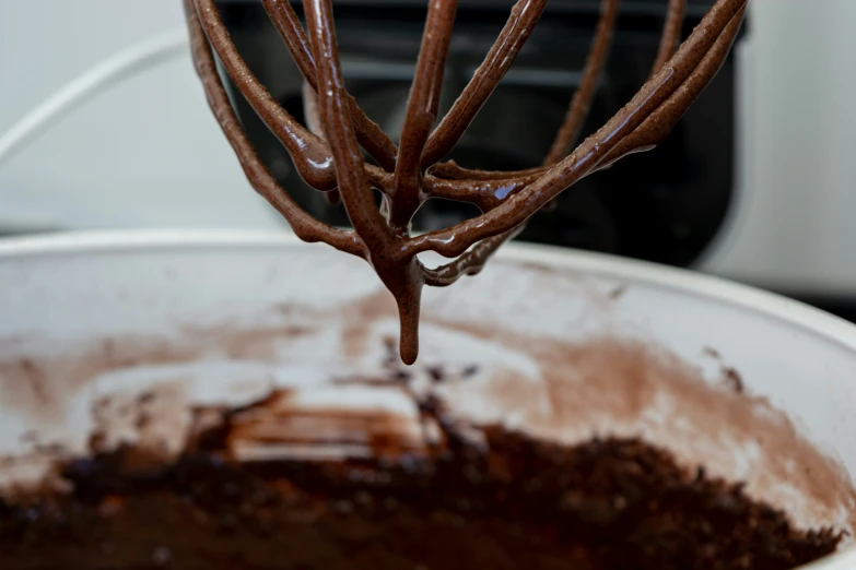 chocolate cake batter being stirred by a mixer