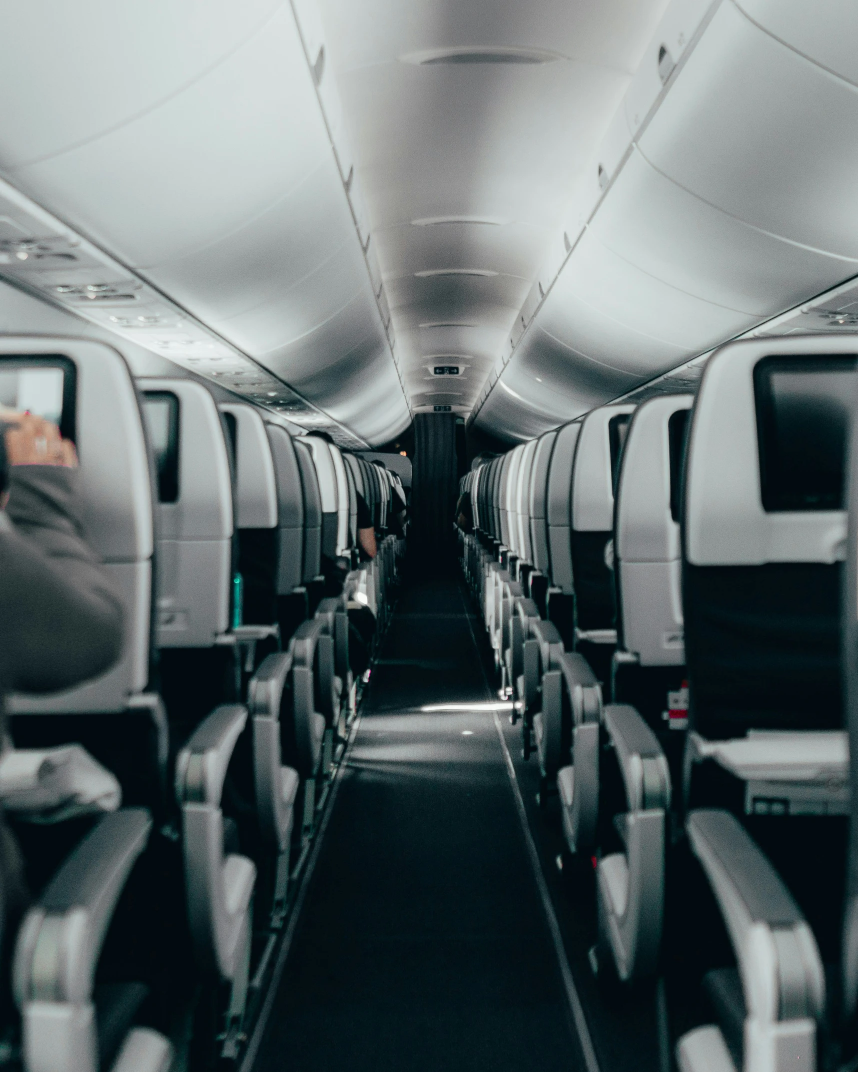 the interior of an airplane with empty seats