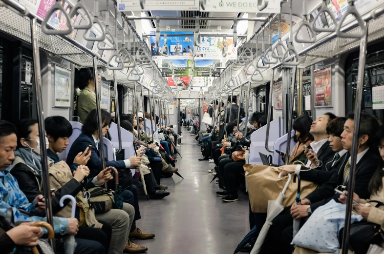 a group of people riding on the train