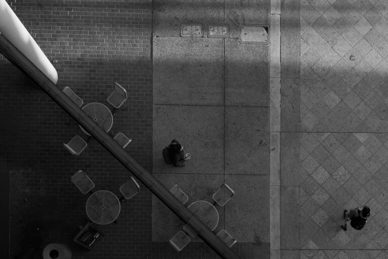 black and white pograph of an overhead view of two empty chairs