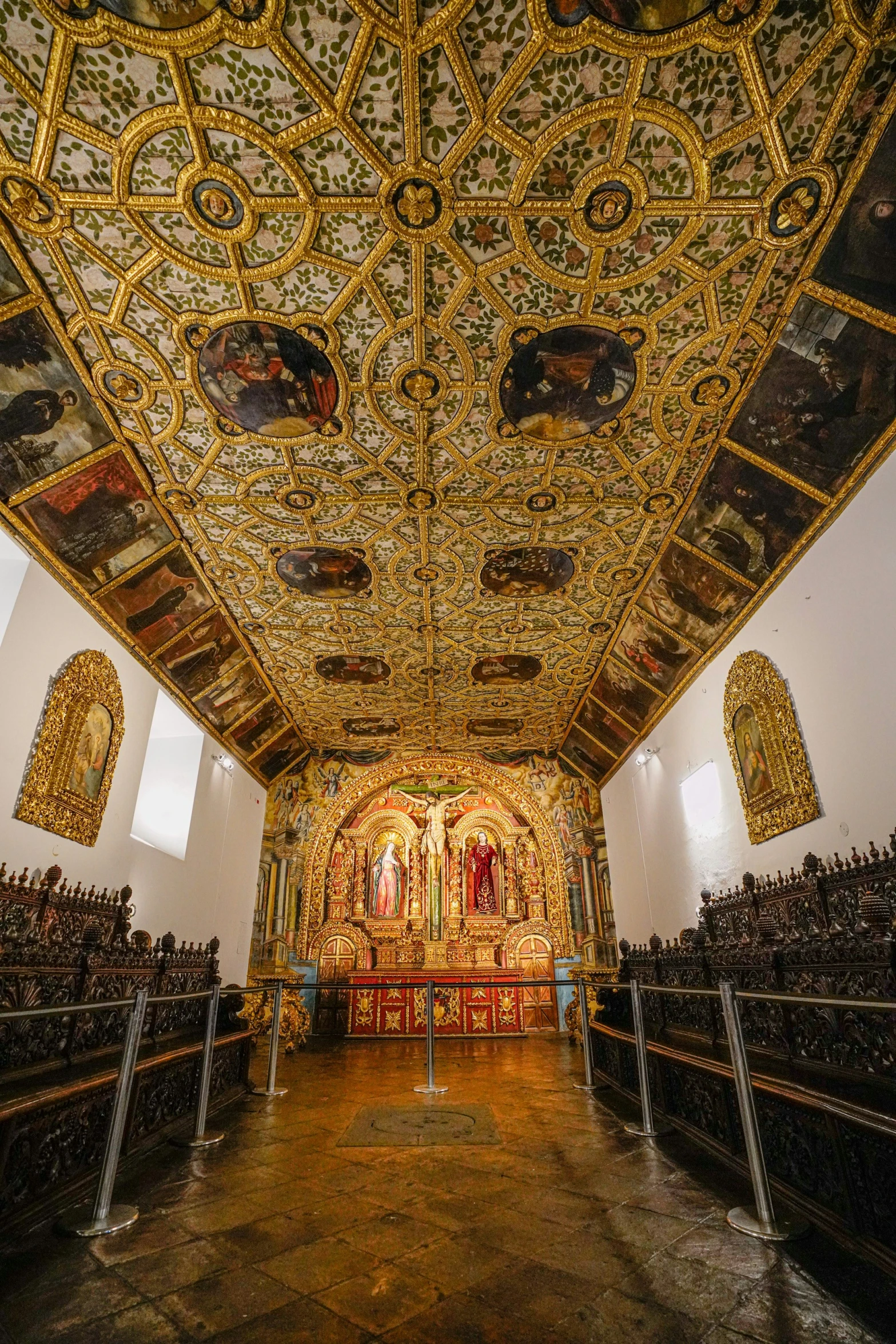 the inside of a church decorated in gold and black