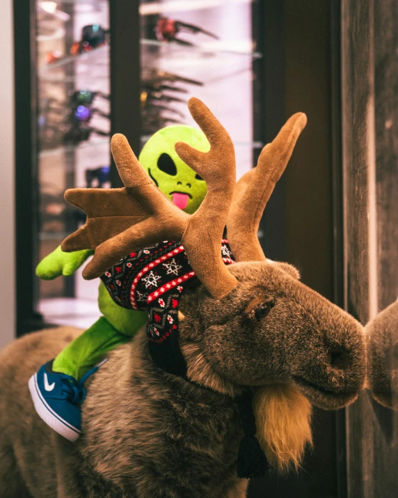 a close up of a stuffed animal with antlers