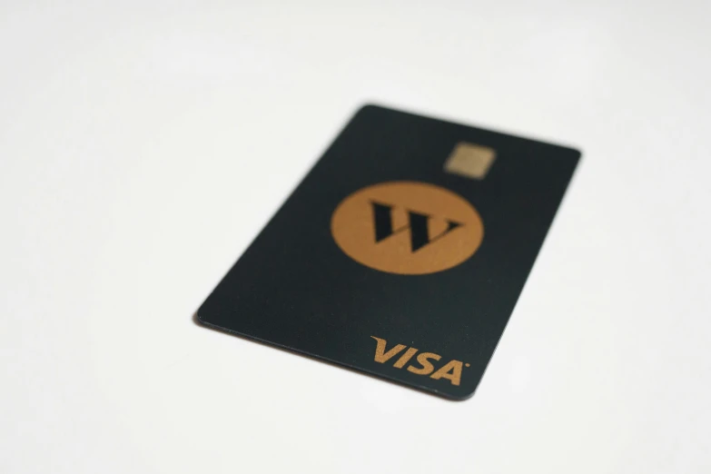 a visa card with a round brown circle in the center