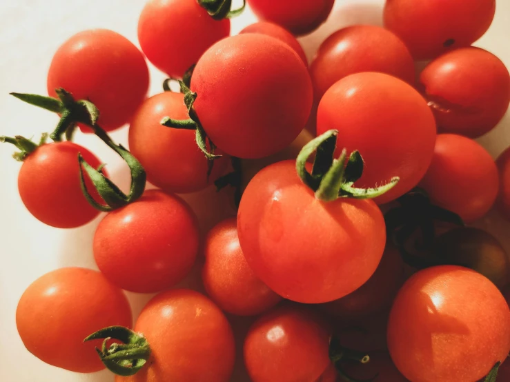 there are many small tomatoes on the table