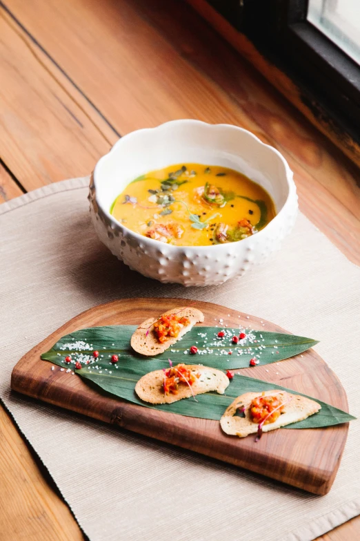 a plate of food with a bowl of soup