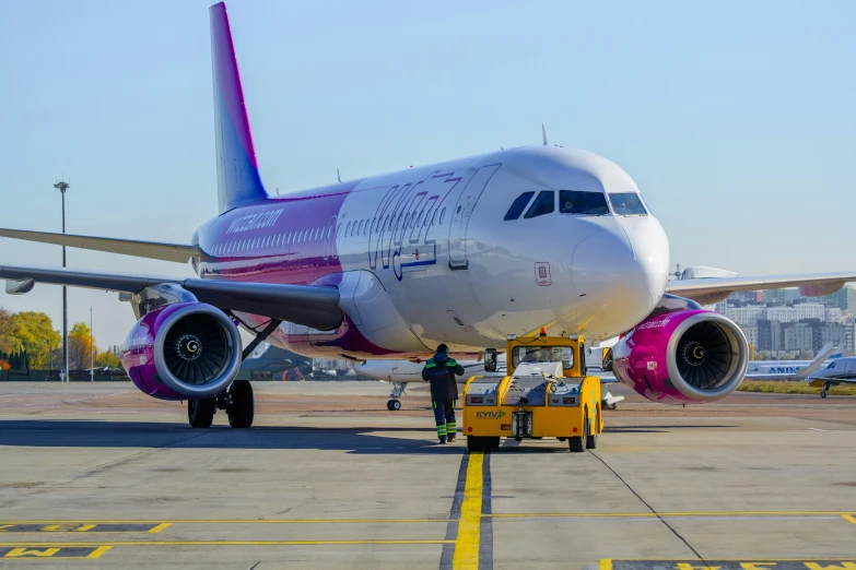 a airplane that is on the runway with its nose and front wheels down