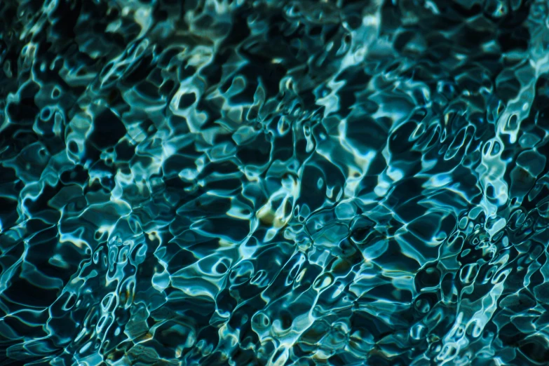 the water in the pool has small bubbles and bubbles