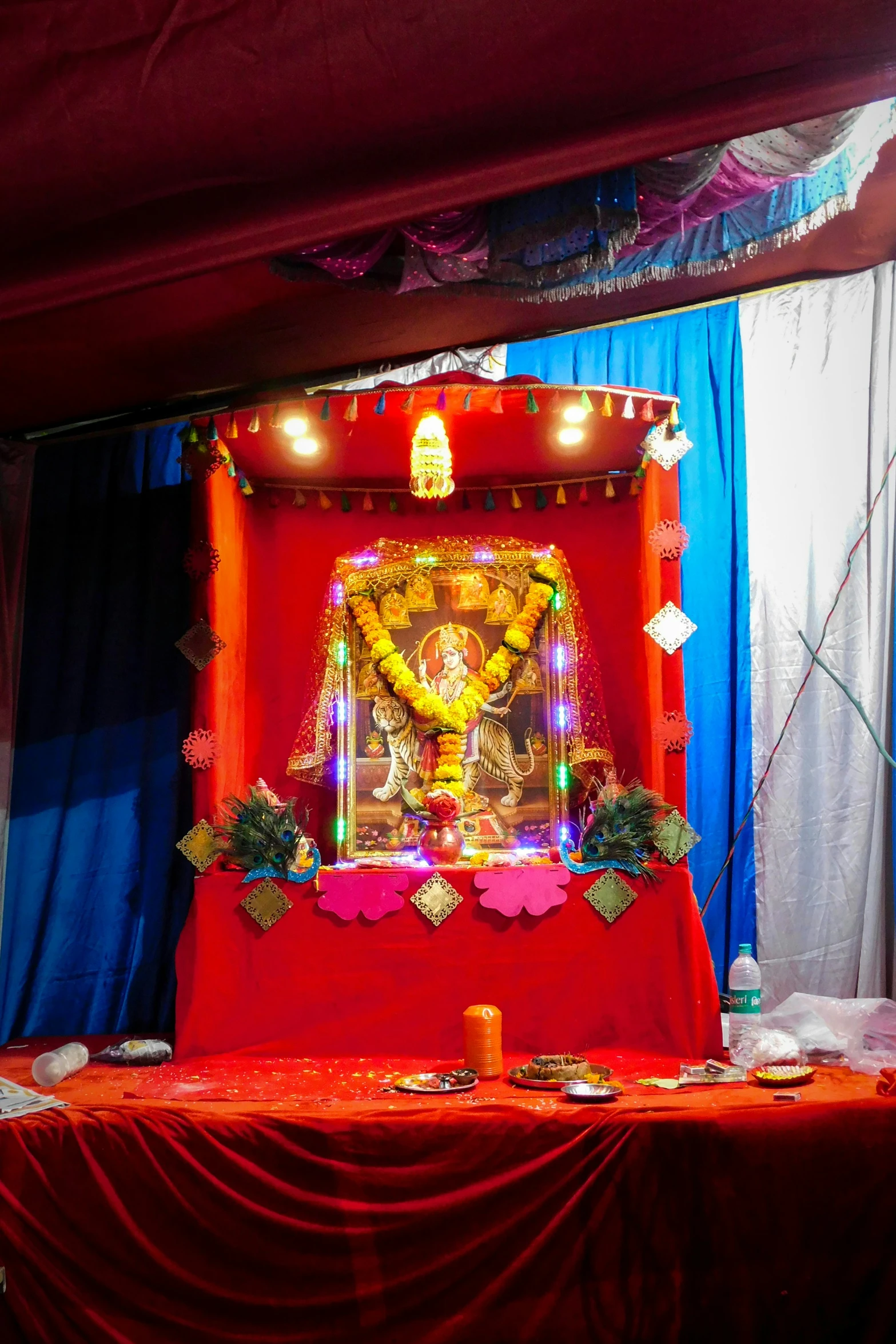 a shrine with red velvet and an altar