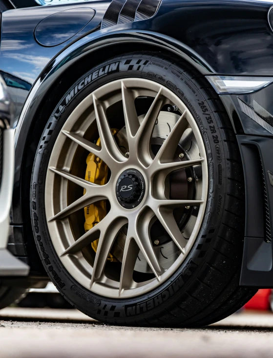 the car tire and wheel of a sports utility vehicle