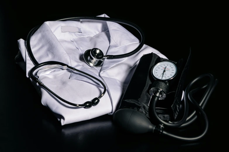 a doctors bag and medical equipment sit on a table