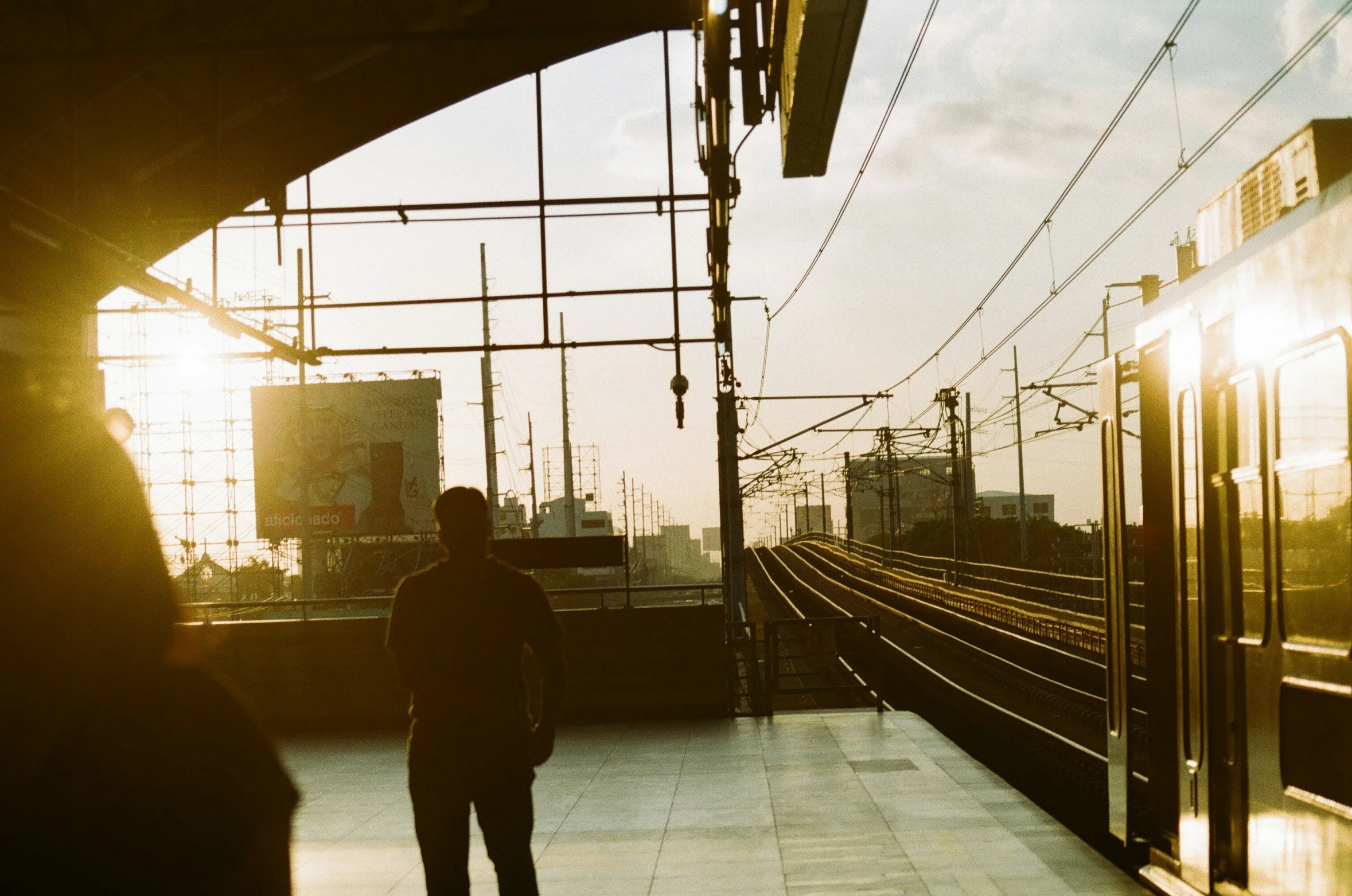 there is a man standing on a train platform