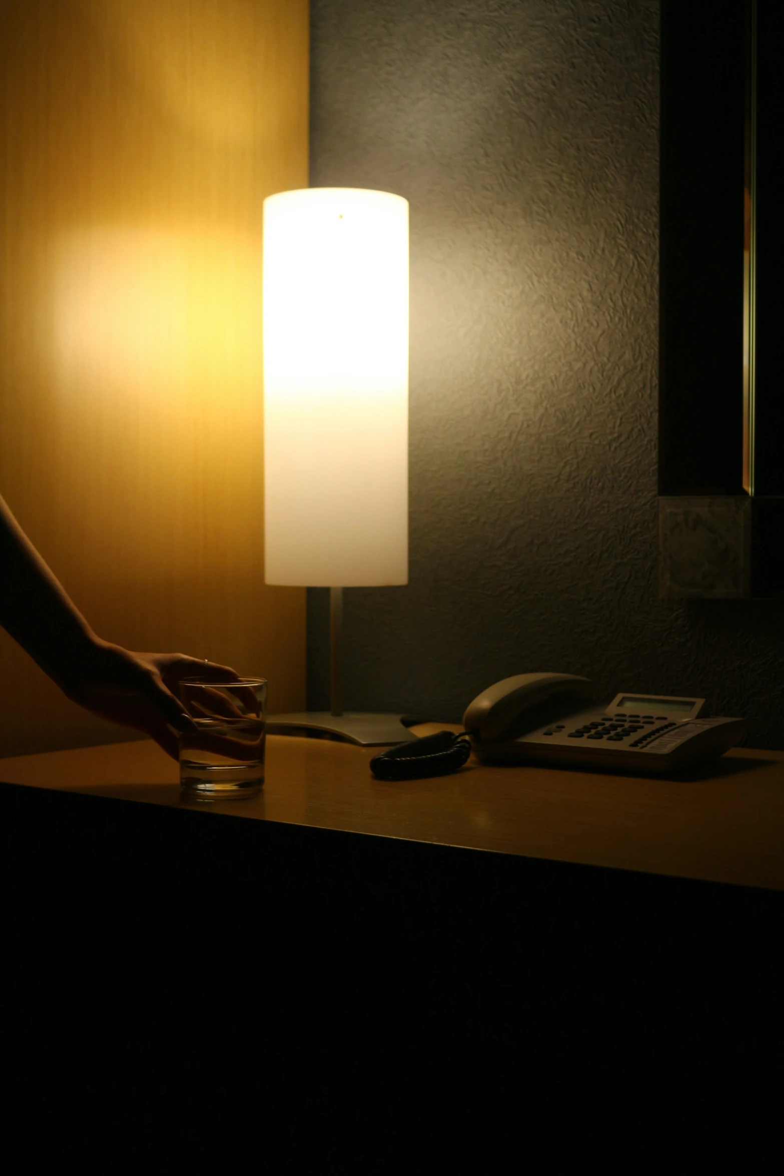 a small, hand lamp in a darkened room