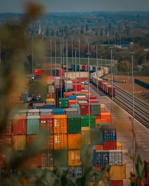 this is an image of a train yard full of cargo cars