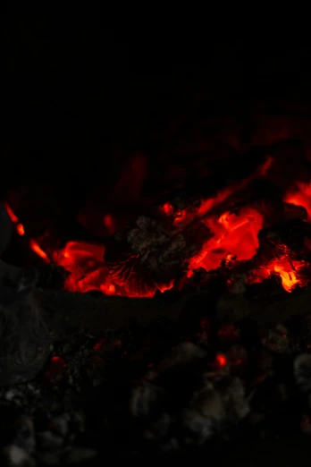  flames glow from the coals as it is lit