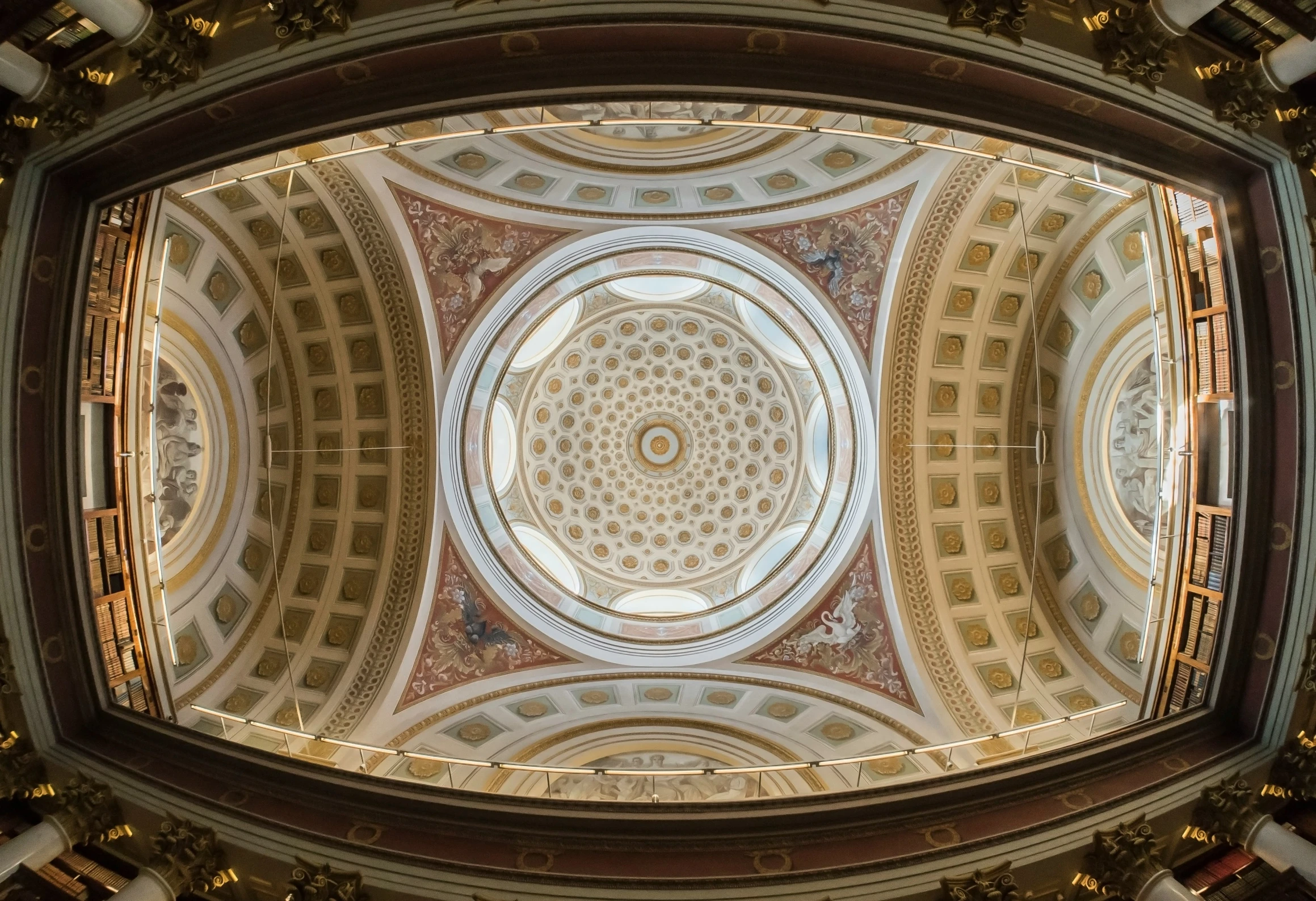 the interior of a building has a ceiling with gold pillars