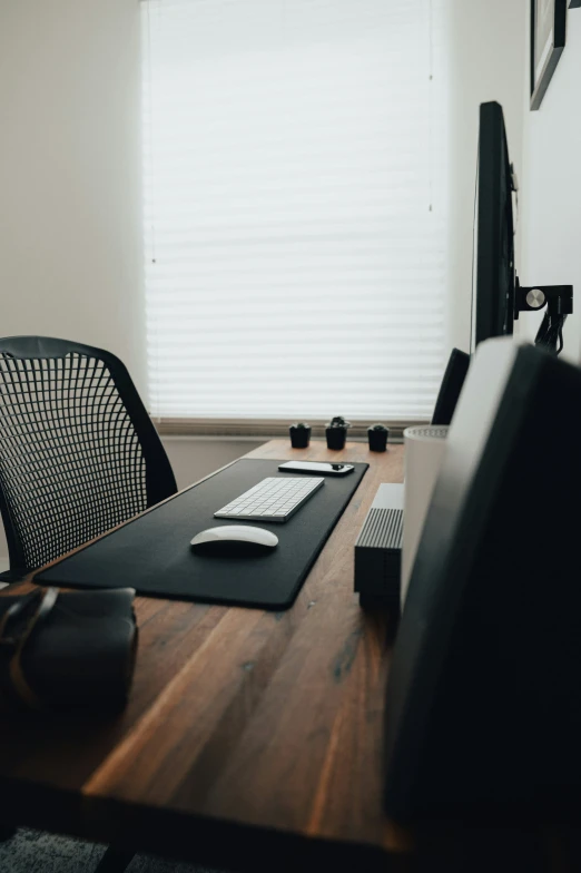 this is an image of a desk with computers on it